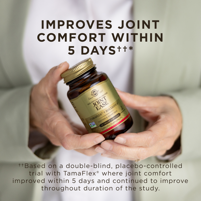 An image of a woman's hands holding an amber glass bottle of Solgar Joint Ease softgel supplement. Text on the image reads, "Improves joint comfort within 5 days ✝✝* ✝✝ Based on a double-blind, placebo-controlled trial with Tamaflex® where joint comfort improved within 5 days and continued to improve throughout duration of the study."