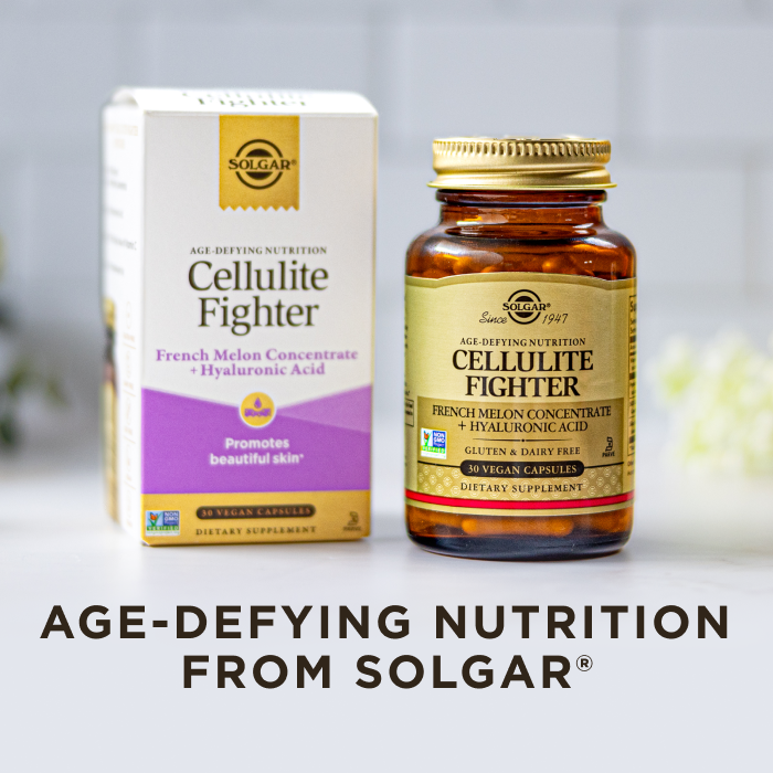 A box and amber glass bottle of Solgar Cellulite Fighter supplement, on a clean white kitchen background. Text on image reads, "Age-defying nutrition from Solgar".