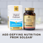 A box and amber glass bottle of Solgar Digital Defense supplement, on a clean white kitchen background. Text on image reads, "Age-defying nutrition from Solgar".