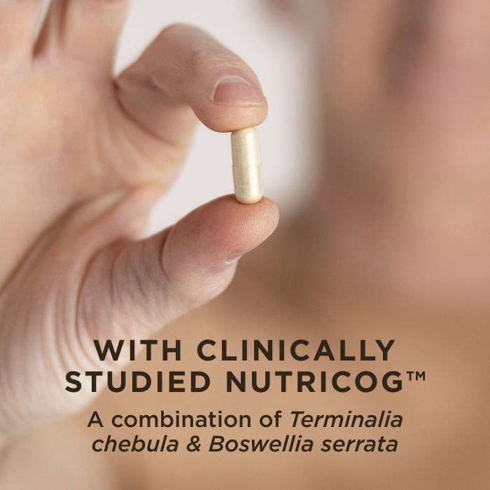 A man holding one capsule of Solgar Memory Support in his fingertips. Text on image reads, "With clinically-studied Nutricog, a combination of Terminalia chebula and Boswellia serrata"