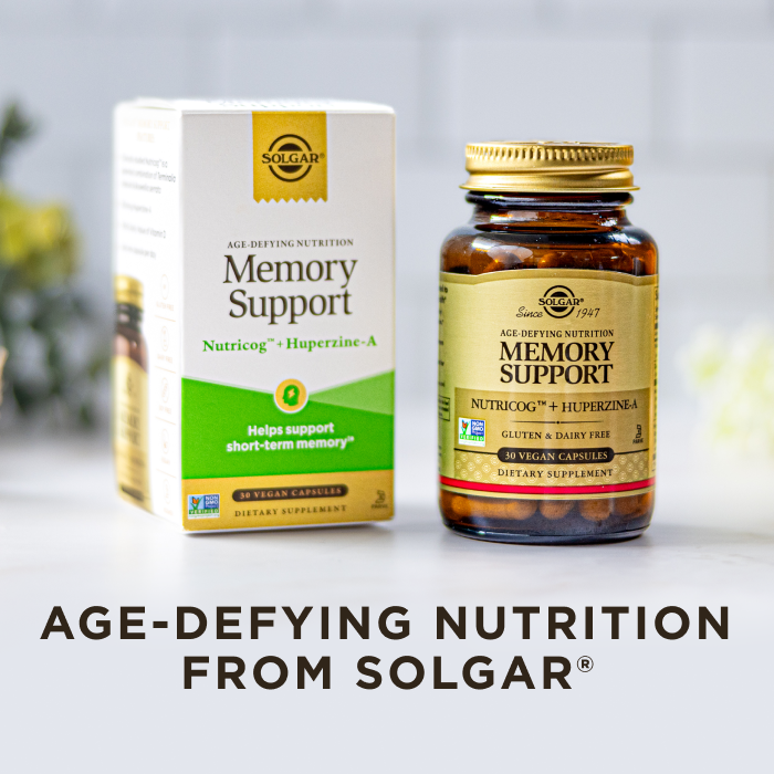 A box and amber glass bottle of Solgar Memory Support supplement, on a clean white kitchen background. Text on image reads, "Age-defying nutrition from Solgar".